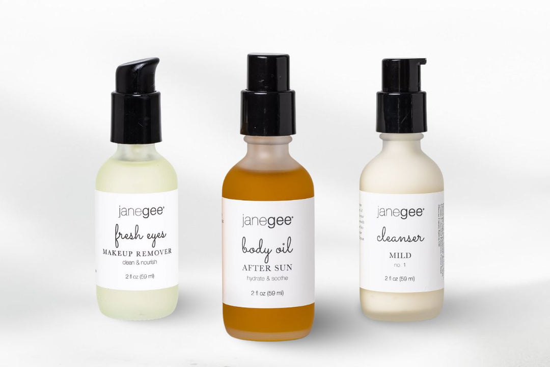 Three janegee skincare products—makeup remover, body oil, and mild cleanser—displayed against a clean white background.