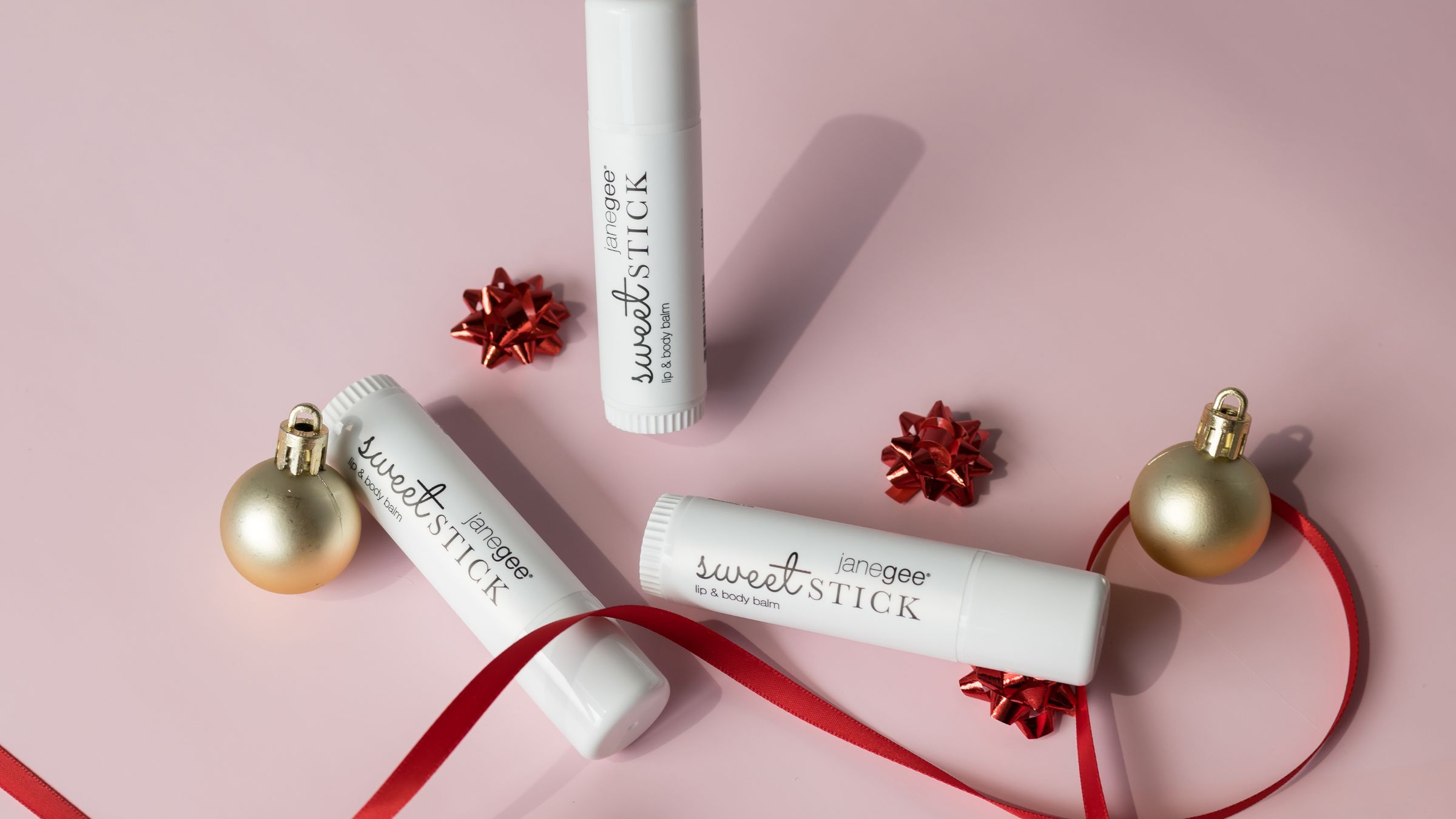 Lip Balms among ornaments and bows