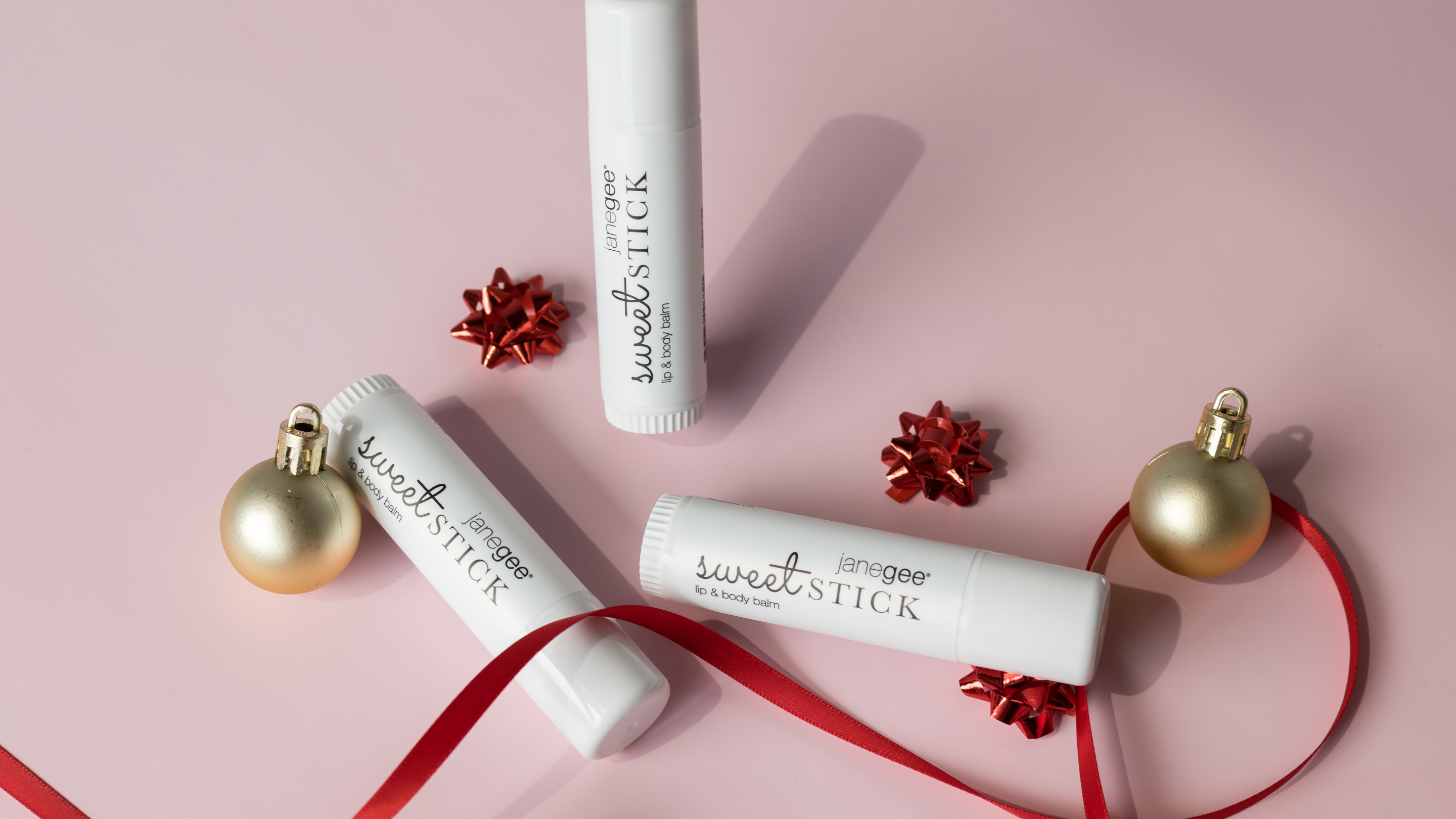 Lip Balms among ornaments and bows