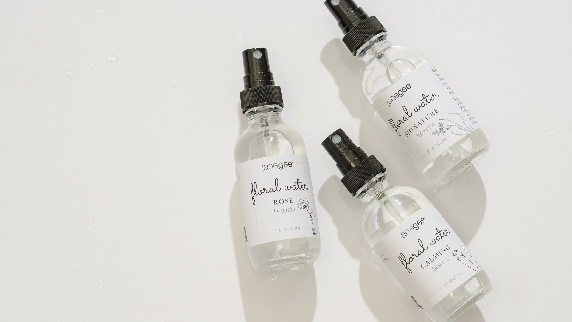 Three janegee Floral Waters face mists styled on a clean white surface