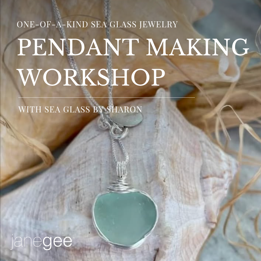 A sea glass pendant necklace wrapped in silver wire displayed on a large seashell with driftwood in the background. White text overlay reads “One-of-a-Kind Sea Glass Jewelry Pendant Making Workshop with Sea Glass by Sharon” with the janegee logo in the bottom left corner.