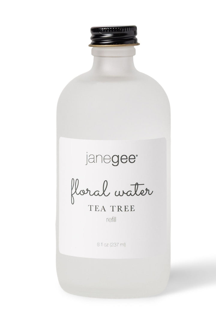 janegee floral water Tea Tree refill, 8 oz, in frosted glass bottle with black cap on a white background