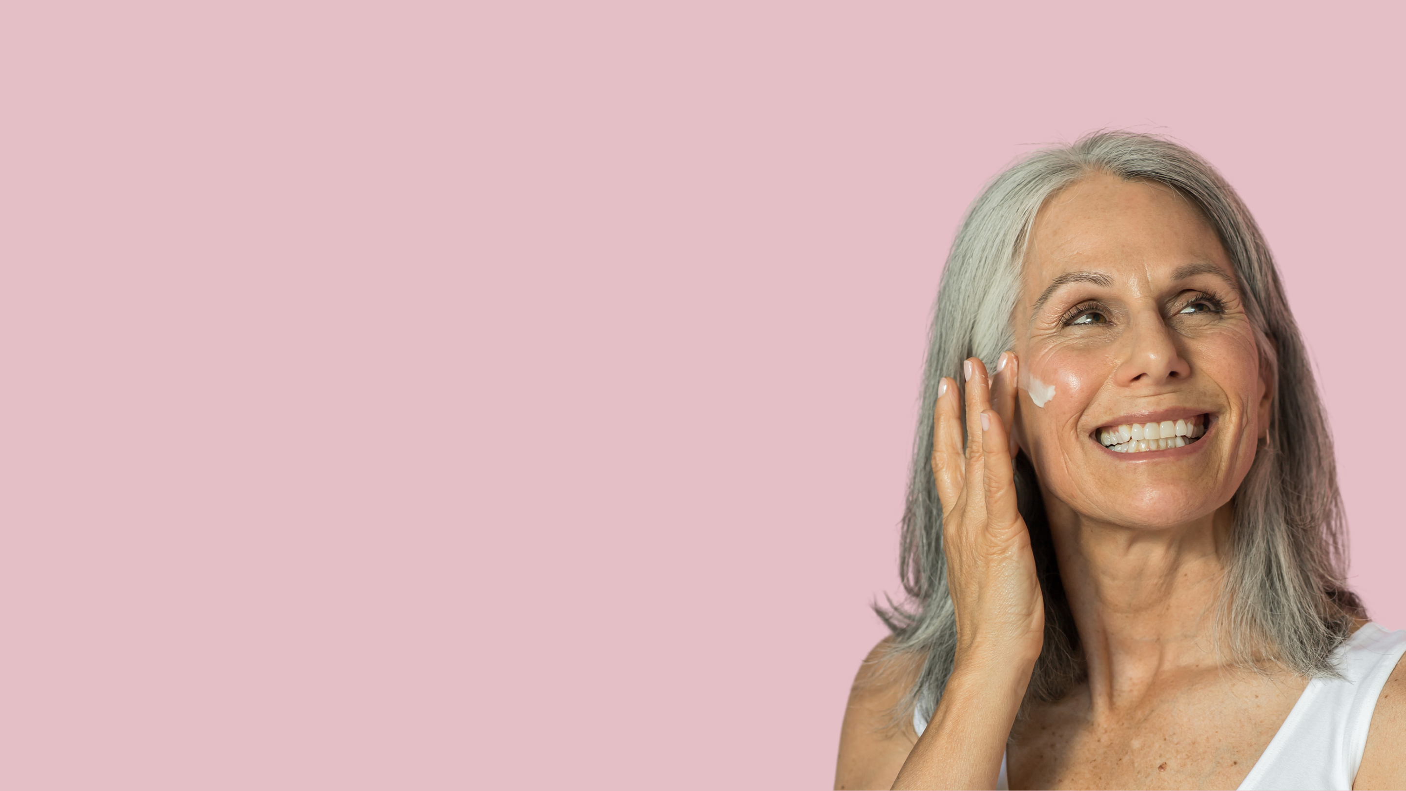 Mature Woman Applying Face Cream