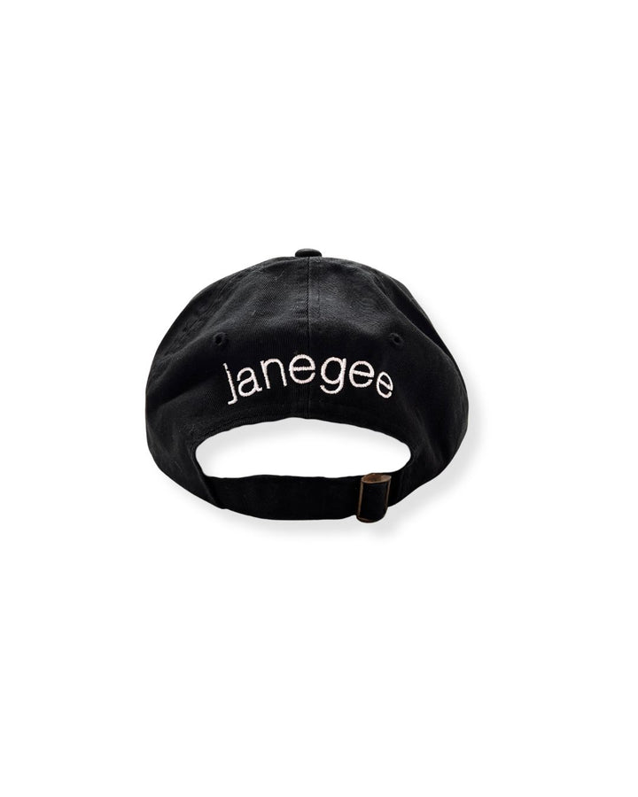 Back view of the black janegee Everyday Botanical Cap with white embroidered janegee logo and adjustable brass buckle strap on a white background.