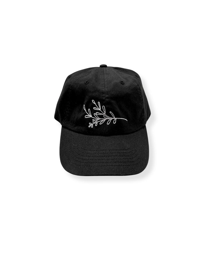 janegee Everyday Botanical Cap in black with white botanical embroidery on the front, shown on a white background.