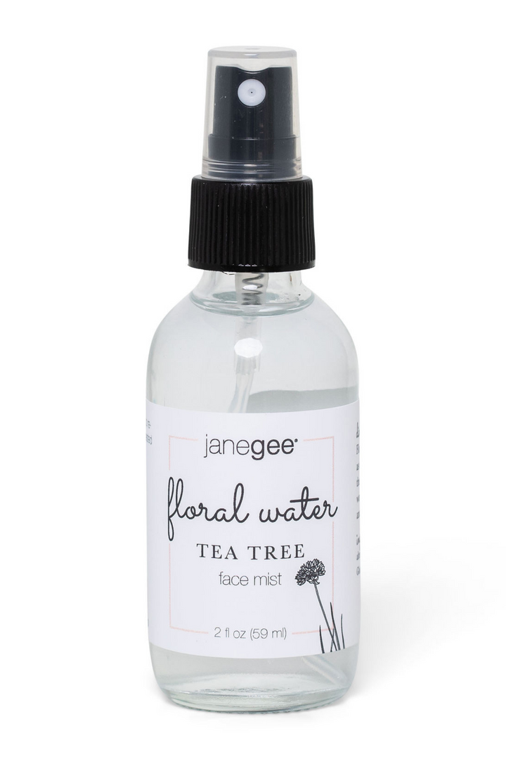janegee floral water Tea Tree face mist, 2 oz, in glass spray bottle with black pump on a white background